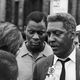 African-American civil rights activist Bayard Rustin (1912 - 1987) talks to a reporter during the Harlem Riots in Manhattan, July 23, 1964.